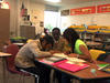 Three children working together at school