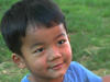 Young boy from Burma smiling at the camera